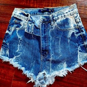 Vintage high waisted distressed jean shorts! Very cute, stretchy, a perfect fit.